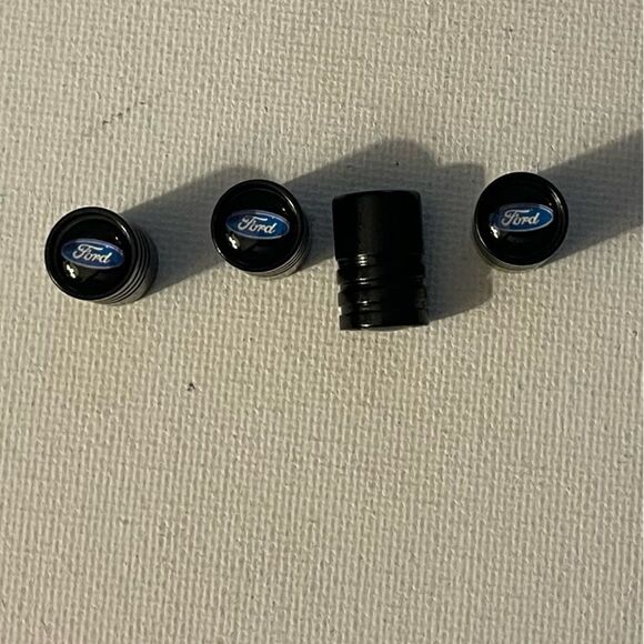 Ford valve Stem caps in Black set of 4 NWT - Picture 1 of 4